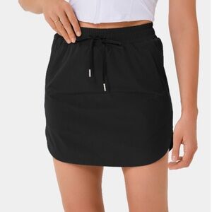 Halara High Waisted Drawstring Side Pocket 2-in-1 Curved Hem Mini Golf Skirt